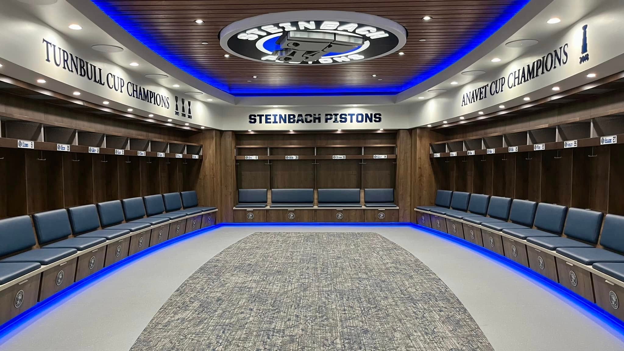 Steinbach Pistons locker room with blue LED accent lighting and championship banners
