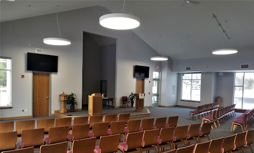 Modern assembly hall interior with contemporary lighting